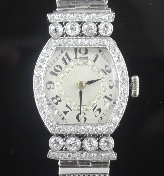 A ladys 1950s white gold and diamond set cocktail watch,